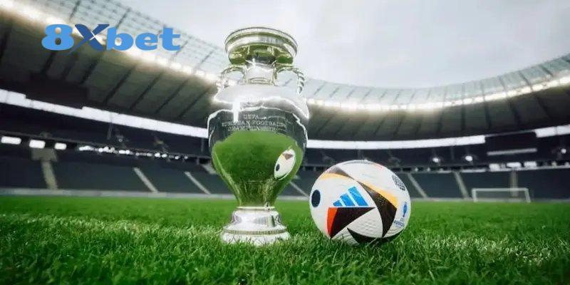 Cúp vô địch và quả bóng trên sân vận động, minh họa biến động odds ở các giải đấu lớn